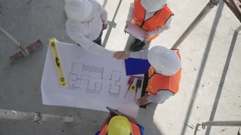 Top view of construction worker handshaking in a house construction site. Stock Footage
