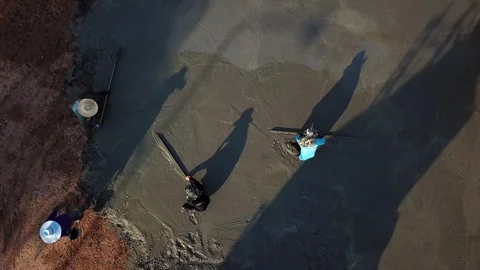 Top View of construction workers pouring cement during Upgrade to the ground. Stock Footage 101569591