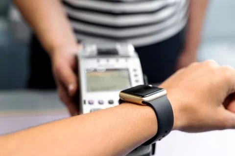 Top view of contactless payment with smart watch. Technology of paypass. Stock Photos
