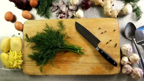 Top view cook cuts dill on a cutting board Video stock 76119433