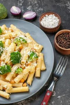 Top view cooked pasta with broccoli on gray background color green food mea.. Stock Photos