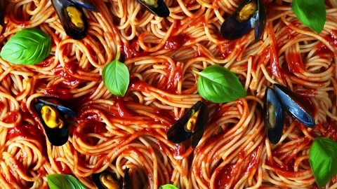Top view of cooked spaghetti with tomato sauce and mussels Stock Footage 141090264