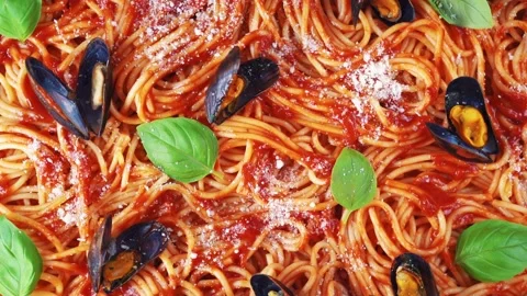 Top view of cooked spaghetti with tomato sauce, mussels amnd parmesan Stock Footage 146911614
