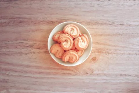 Top view Cookie in white plate on wooden table,cookie vintage tone Stock Photos