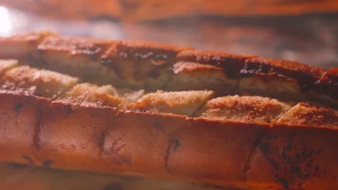 Top View of Cooking Garlic Bread Baguette Cooking in Oven. Stockbeeldmateriaal 337967614