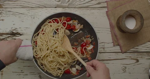 Top view of cooking spaghetti with tomatoes and seafood Stock Footage 148340793