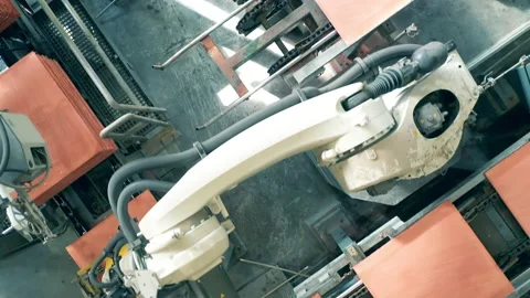 Top view of copper pieces getting transported by industrial robots Stock Footage 158161887
