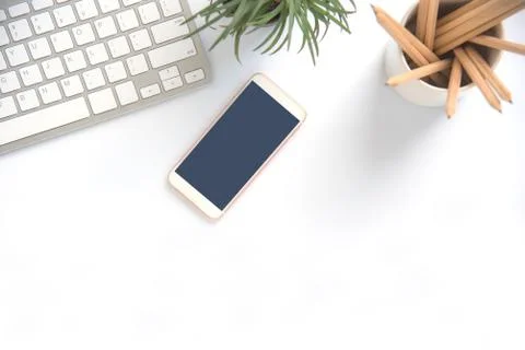 Top view with copy space, working desk with laptop,cell phone,notebook pencil Stock Photos