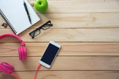 Top view with copy space, working desk with cell phone,notebook pencil in the Stock Photos