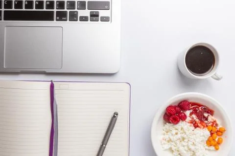 Top view, copyspace, white table, computer, coffee, curd and jam Stock Photos