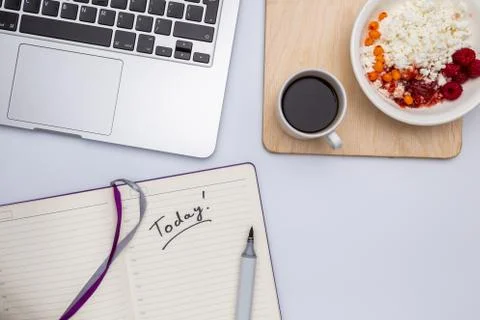 Top view, copyspace, white table, computer, coffee, curd and jam Stock Photos