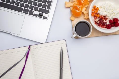 Top view, copyspace, white table, computer, coffee, diary, curd Stock Photos