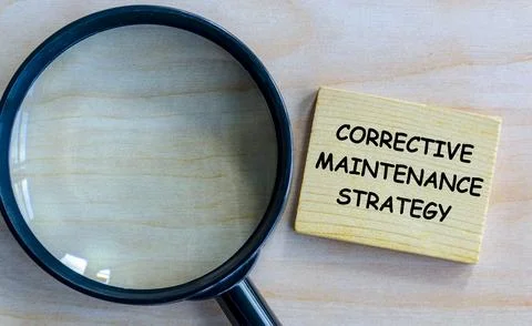 Top view of Corrective Maintenance Strategy text on wooden blocks with magn.. 스톡 사진