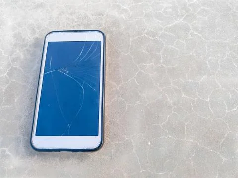 Top view of cracked broken screen of a mobile phone Stock Photos