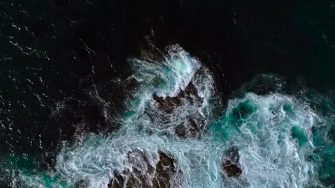 Top View Of Crashing Rough Waves In Rugged Coastline. Slow Motion Shot Video stock 317442281