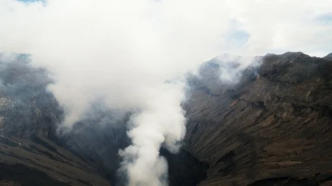 Top view of crater Mount Bromo is active volcano smoke. Video stock 102732704