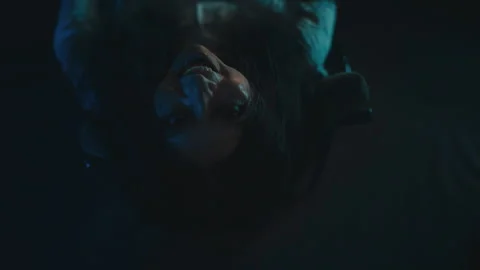 Top view of crazy evil witch laughing while sitting in armchair in haunted house Stock Footage 257005626