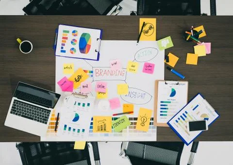 Top view of creative designer brainstorming ducument on wood table in meeting Stock Photos