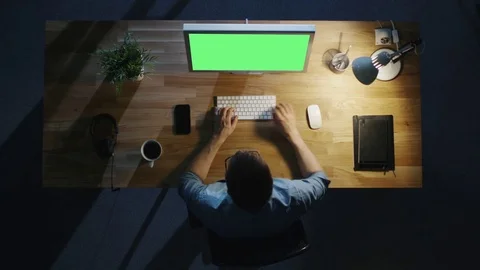 Top View of Creative Man Working at His Desktop Computer with  Green Screen Stock Footage 71467215
