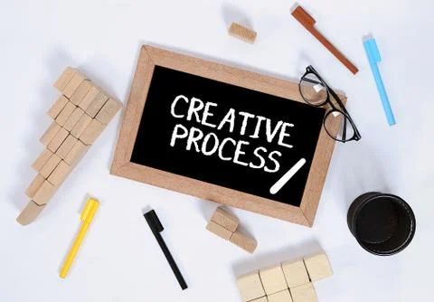 Top view of creative process / Creative process on blackboard with wood block Stock Photos