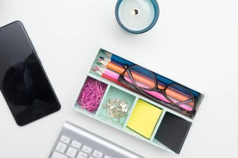 Top view of creative work space on white desk Stock Photos