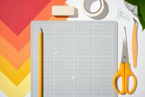 Top view creative workspace with cutting mat, scissors, glue, pencil and or.. 스톡 사진