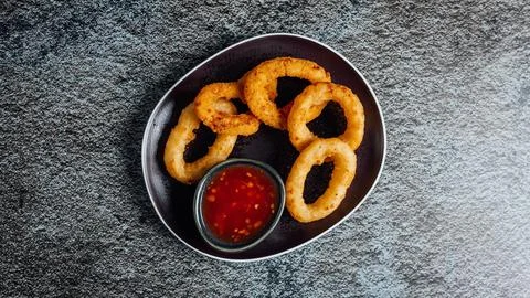 Top view of crispy squid rings with ketchup Stock Photos
