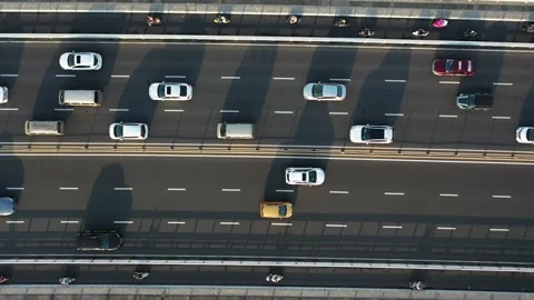 Top view of a crowded slow-moving car on an elevated bridge Видео 234732351