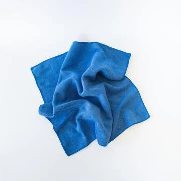Top View of Crumpled Blue Microfiber Cleaning Cloth on White Background Stock Photos
