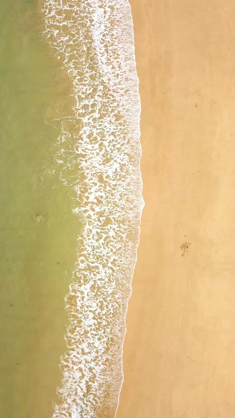 Top View Of Crystal Clear Ocean Waves On Sandy Beach, Natural Background. Video stock 274099278
