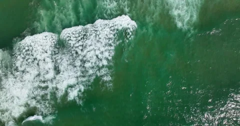 Top view of crystal clear sea and sand beach 5k Video stock 240960848