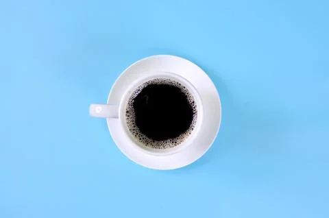 Top view of Cup of coffee on blue background Stock Photos