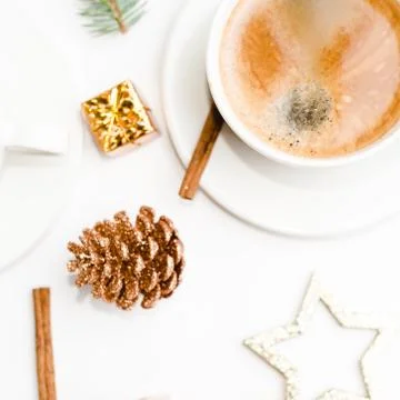 Top view of a cup of coffee, isolate on white with Christmas toys, pine cones Stock Photos