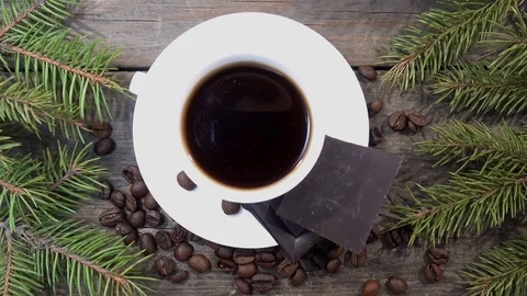 Top view of a cup of coffee with spruce branches Stock Footage 83529106