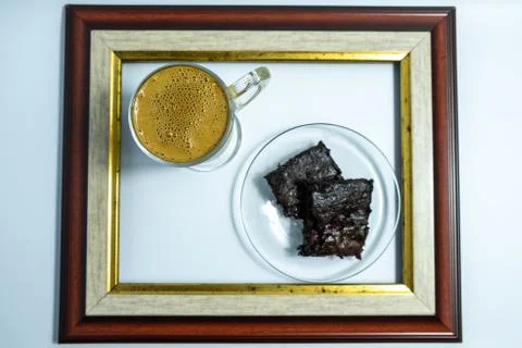 Top view of a cup of dalgona coffee and homemade brownie in the frame Stock Photos
