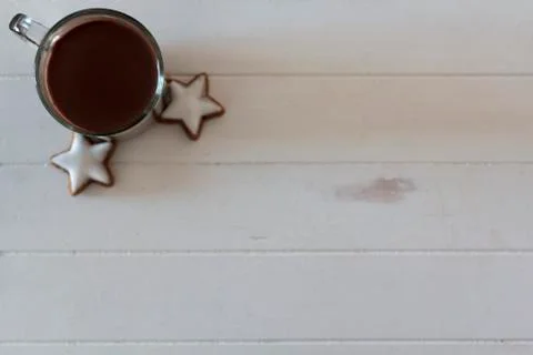 Top view of cup with hot chocolate and coookies on white wooden table with co Stock Photos