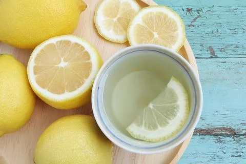 Top view of Cup of tea and fresh lemon on light blue Stock Photos