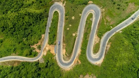Top View Of The Curve road Through The Trees Video stock 96136418