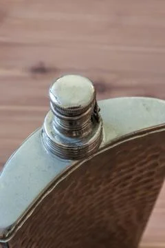 Top view of curved flask, drinking alcoholism addiction concept Stock Photos