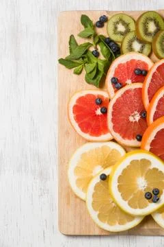 Top view on cut red and yellow grapefruit with mint. Fresh organic citrus, ki Stock Photos