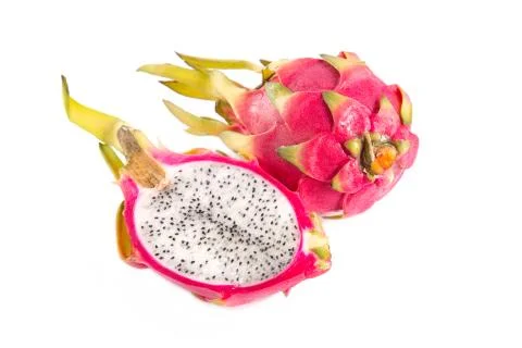 Top view of cut section of dragon fruit and a whole one Stock Photos