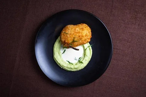 Top view cutlet with mashed potatoes on a black plate Stock Photos