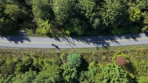 Top View Cyclist Riding Fast On Open Road During Summer Sport Training Session Stock Footage 317901821