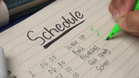 Top view of dailiy routine checklist on book Stock Footage 276807555