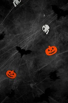 Top view on dark halloween background with bats,spiders,skulls and spider web Stock Photos