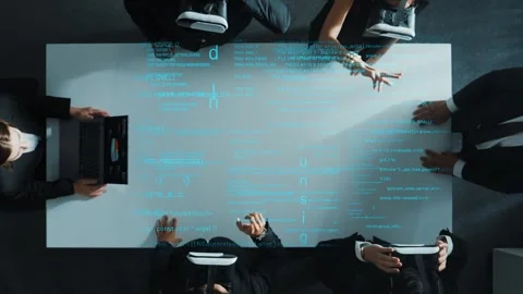 Top view of data analysts wearing VR headset stands coding program. Stock Footage 265185468