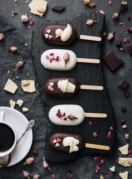 Top view of decorated cake pops ice creams on black background Stock Photos