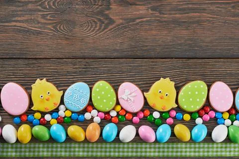 Top view of decorated easter cookies on wooden background Stock Photos
