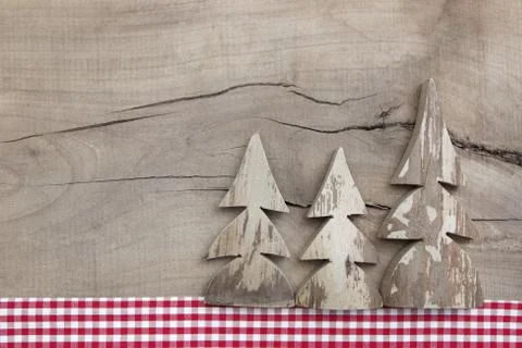Top view of decoration with three pine tree on wooden background Stock Photos