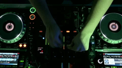 Top view of a deejay mixing music in Night Club Disco Party. Stock Footage 167565971
